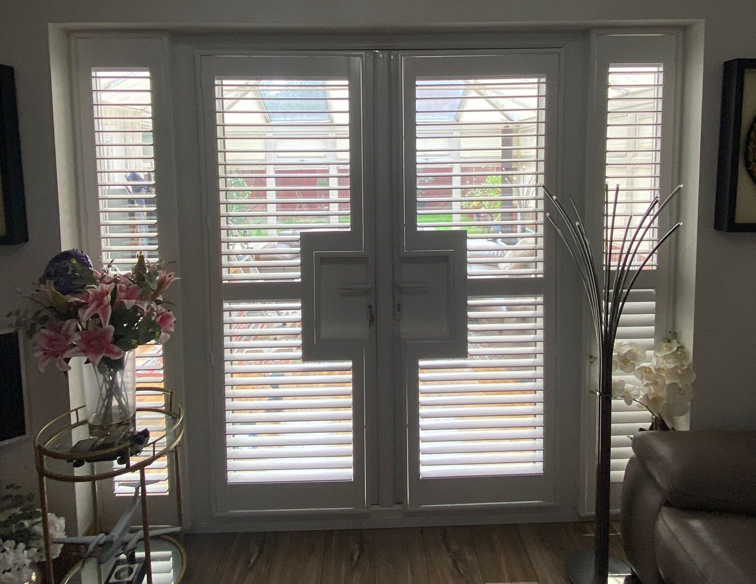 French cut plantation shutters Hampshire patio doors — bespoke cut-outs for handles