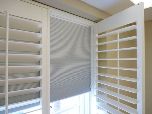 Blackout plantation shutters Hampshire open view showing integrated blind — Shutters by Balaz
