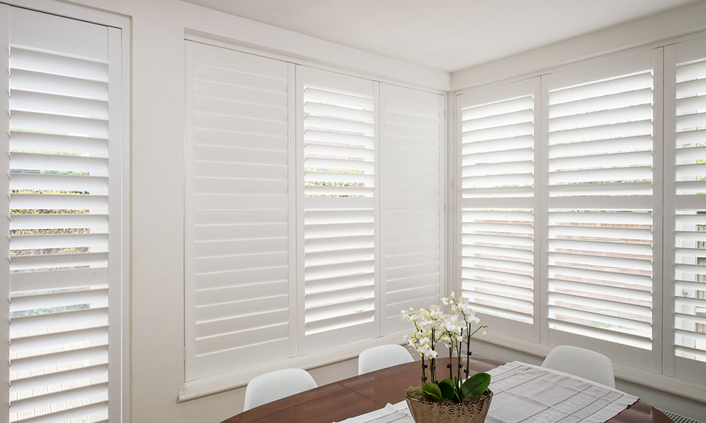 Full height plantation shutters in a dining room