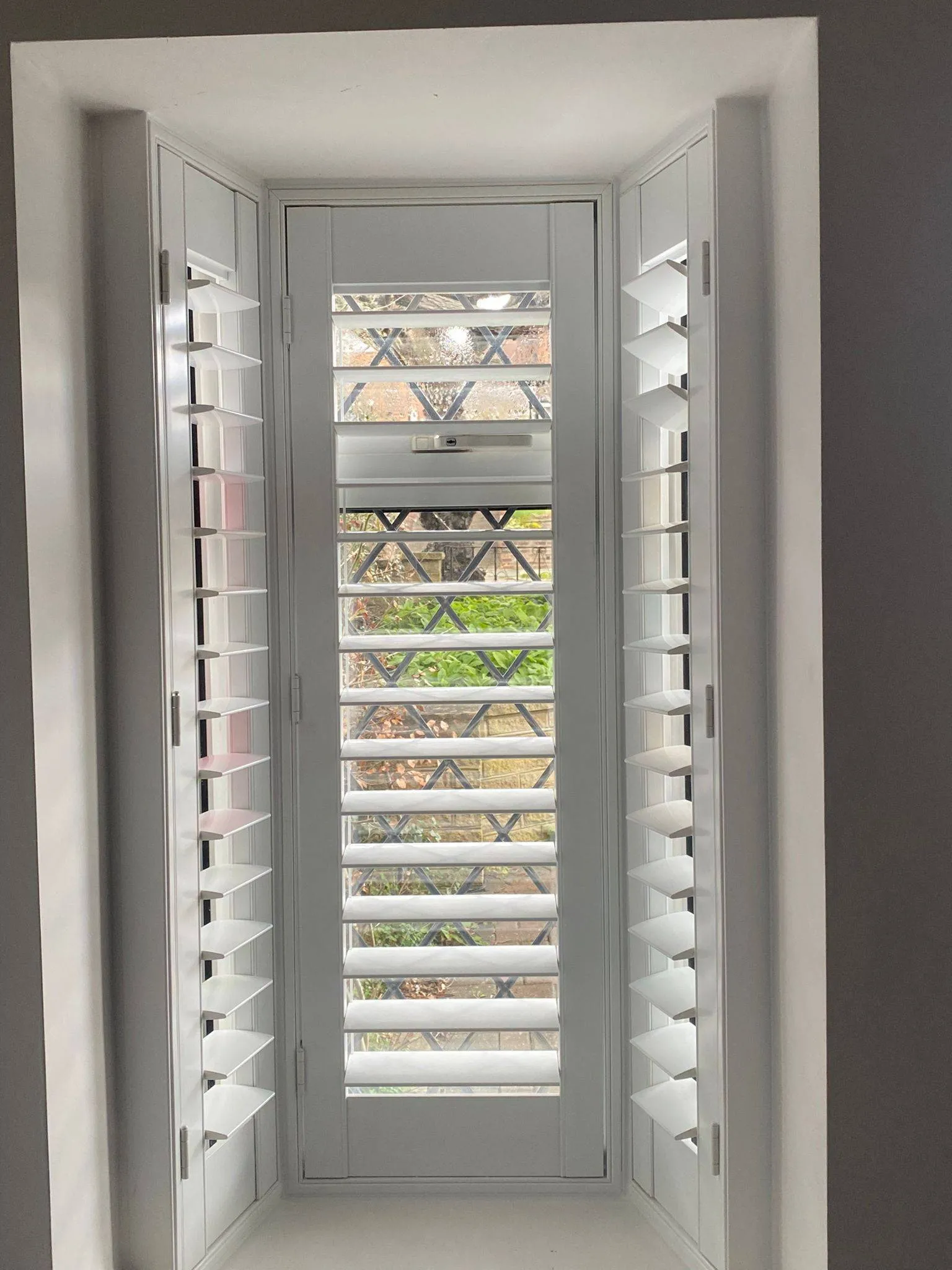 Small box bay window plantation shutters Hampshire — perfectly fitted full height panels
