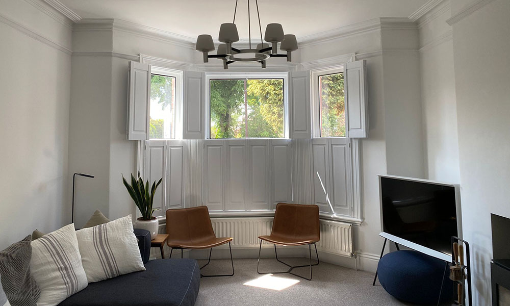 Solid panel plantation shutters Hampshire bay window — contemporary privacy shutters